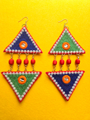 Harmony Crystal Triangle Earrings Top and bottom mix and match green and blue embroidered fabric triangle shaped earrings arranged in a diamond shape. Red clay beads with glass crystals are linked between earrings where bottom edges of triangles meet. Earrings are mostly green and blue with hints of red, white, and orange with a small mirrored center. Earrings are 5.5 inches long and 2.5 inches wide with 18k gold plated ear wires.