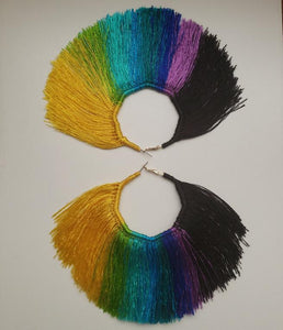 Fan shaped Multi-Colored Tassel Hoop earrings that are yellow, lime-green, blue, purple, and black. Made with satin thread.